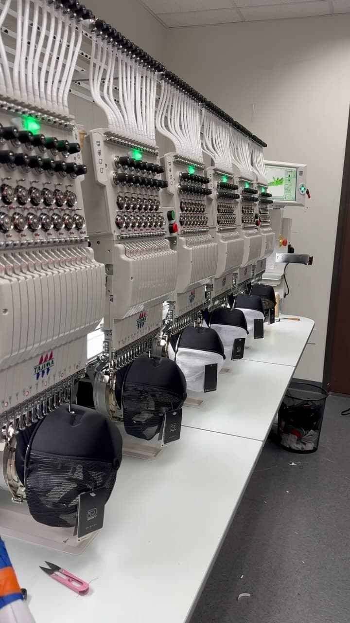 It’s all in the details 👀🔥⁣ Embroidery work 🪡⁣ ⁣ #embroidery #manufacturing #truckerhat